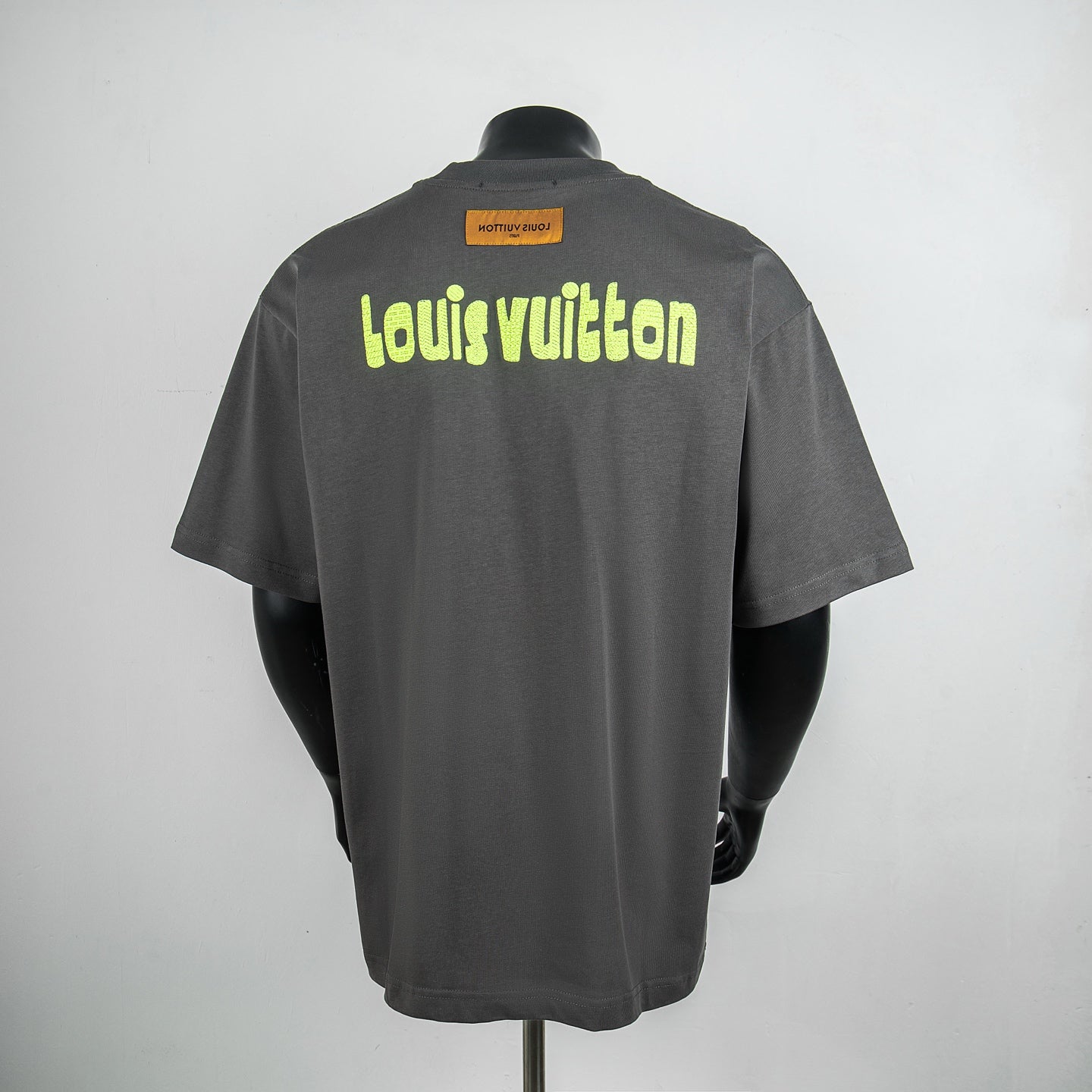 Dark gray short-sleeve T-shirt with neon green Louis Vuitton logo on back