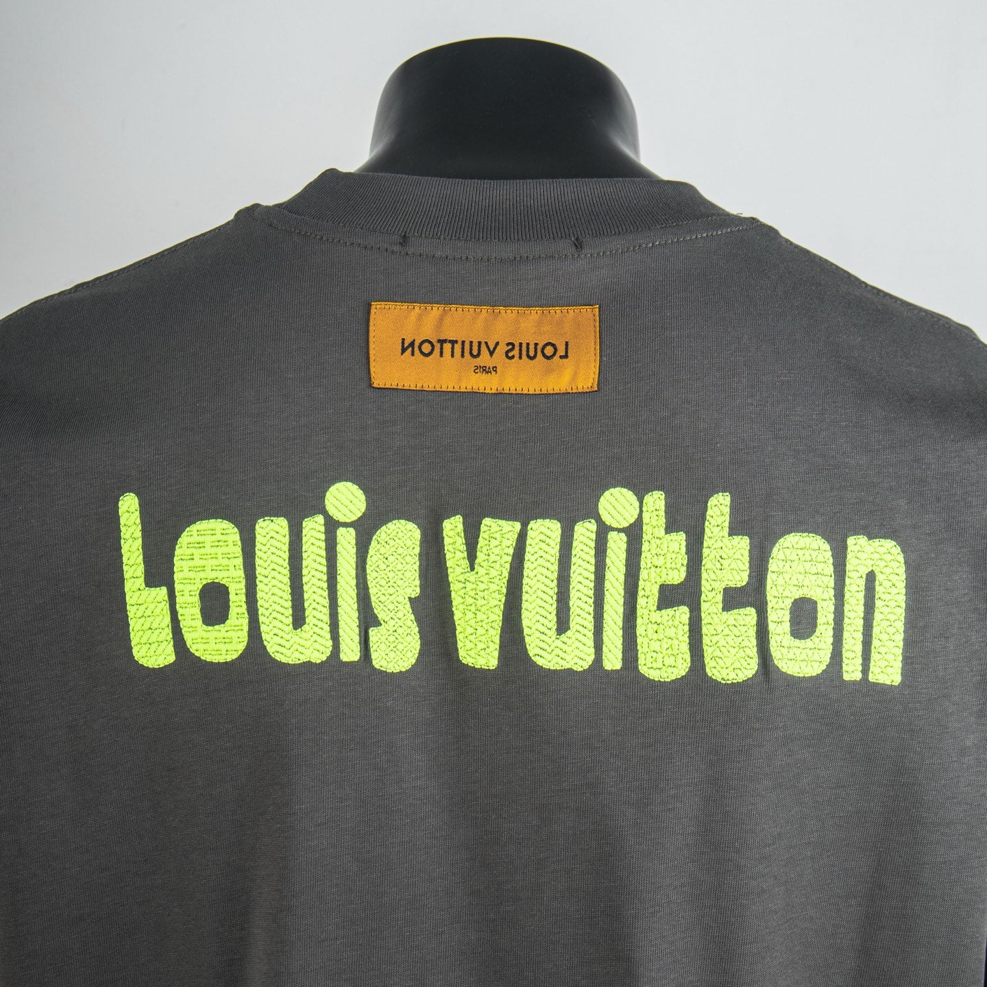 Charcoal short-sleeve T-shirt back with neon green Louis Vuitton text logo