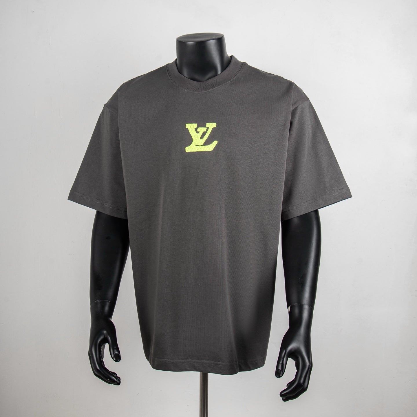 Charcoal short-sleeve T-shirt with neon green LV logo on front