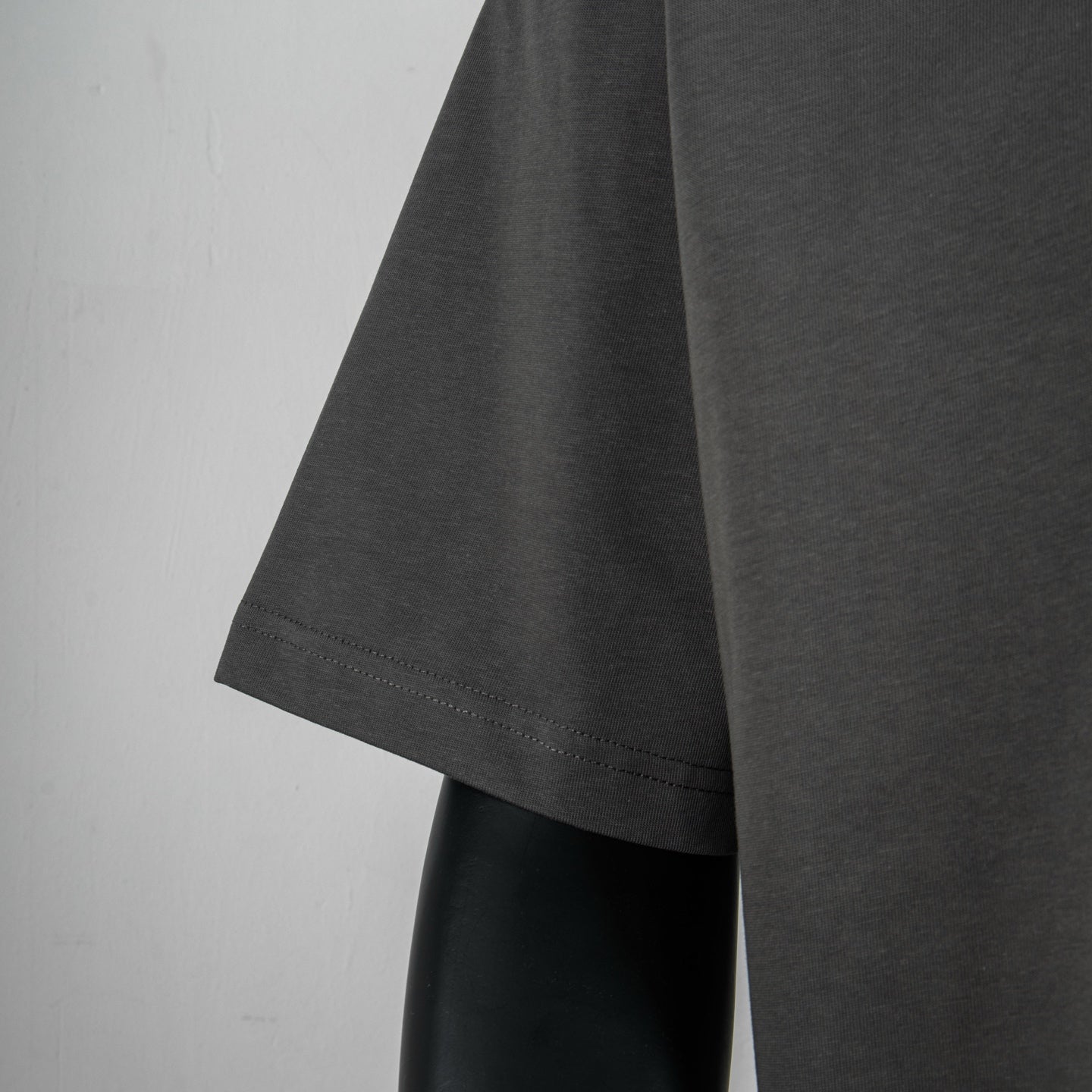 Charcoal short-sleeve T-shirt sleeve hem detail