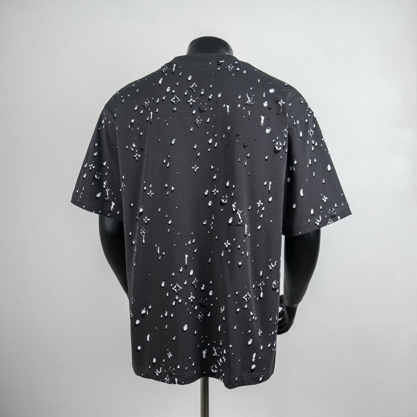 Black short-sleeve T-shirt with allover white logo pattern, crew neck
