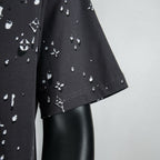 Louis Vuitton black short-sleeve shirt hem with scattered white emblem print