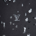 Black knit T-shirt with white logo icons pattern detail