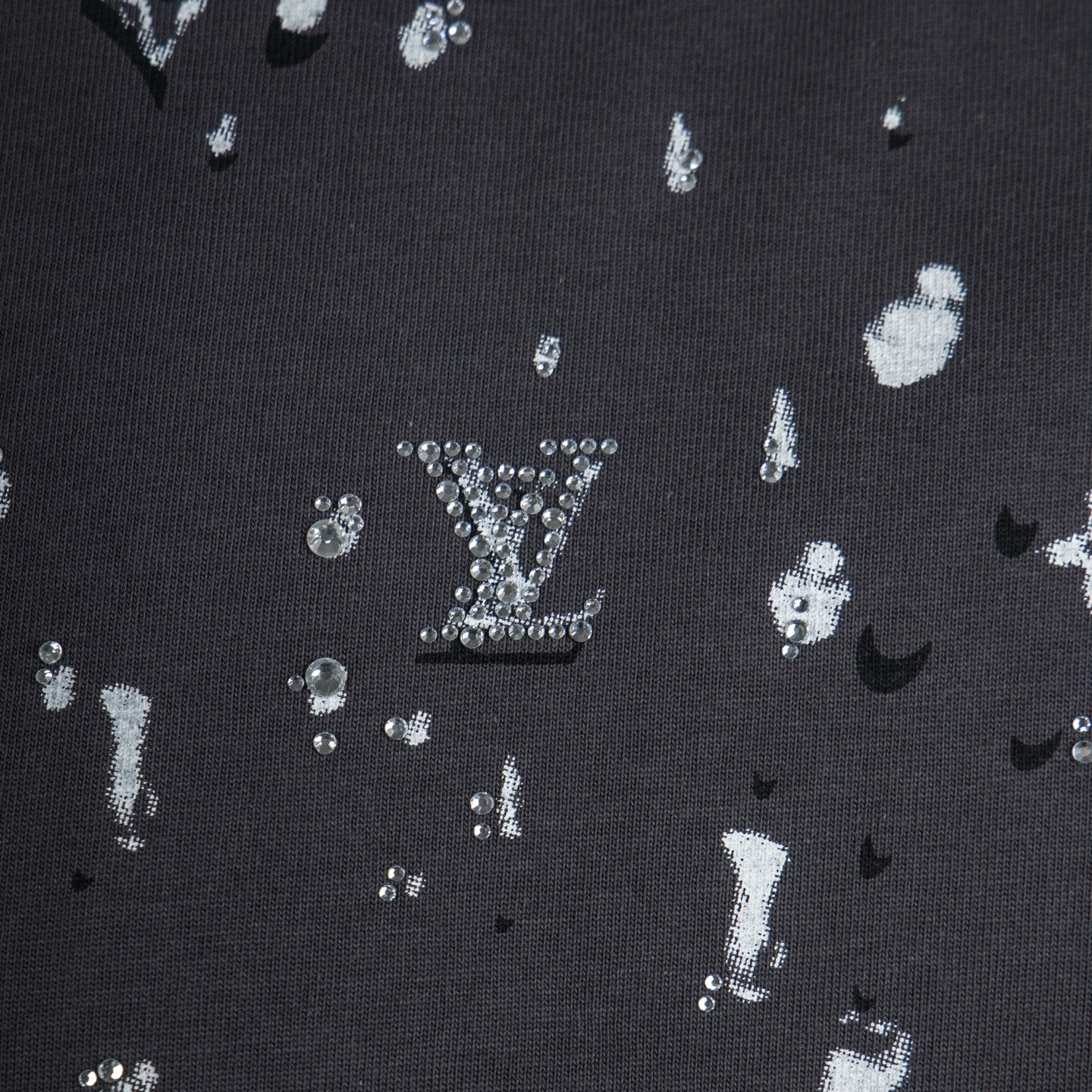 Black knit T-shirt with white logo icons pattern detail
