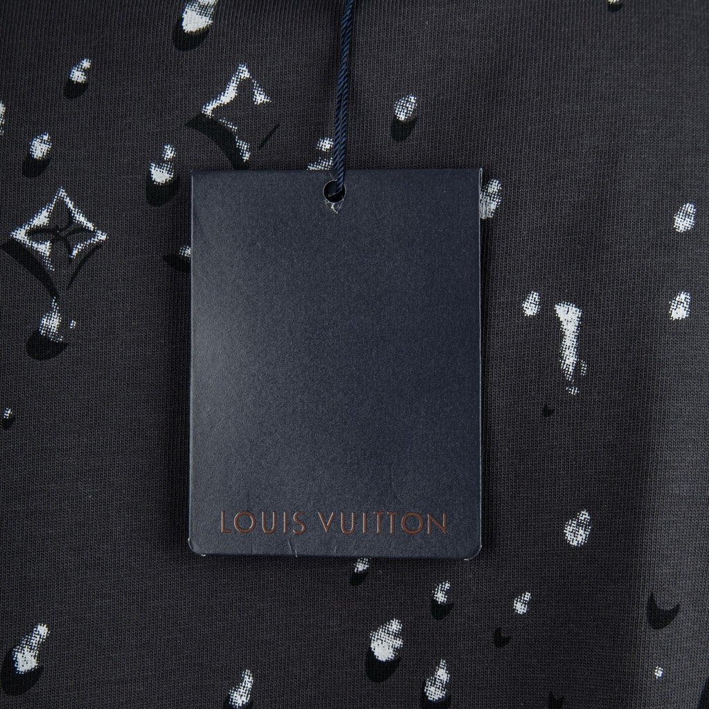 Black T-shirt with Louis Vuitton hanging tag and white logo pattern