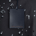 Black T-shirt with Louis Vuitton hanging tag and white logo pattern