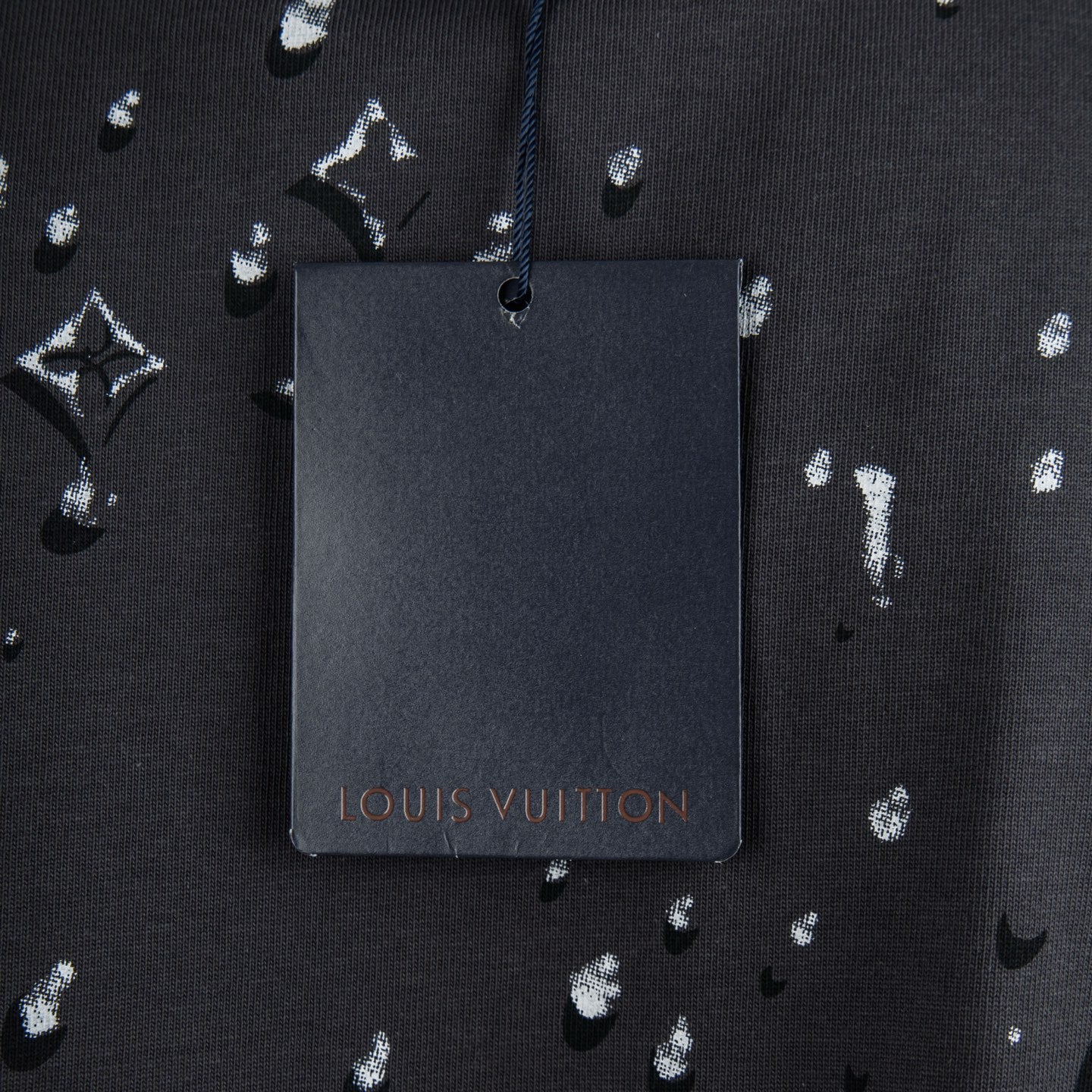 Black T-shirt with Louis Vuitton hanging tag and white logo pattern