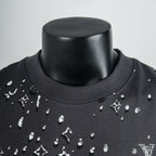 Black crew-neck T-shirt with white logo print detail at collar