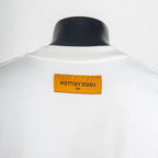 White short-sleeve T-shirt back with yellow brand label at upper collar