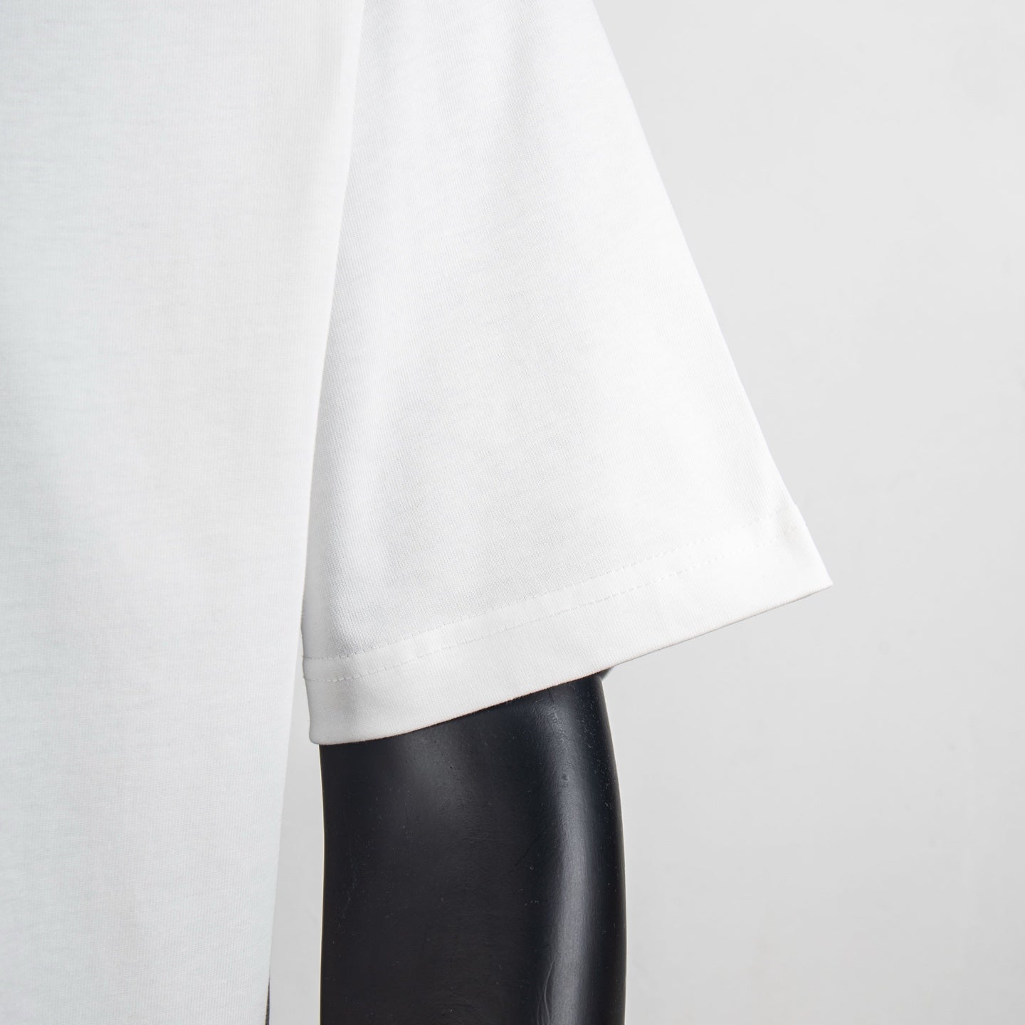 White T-shirt sleeve and side hem view