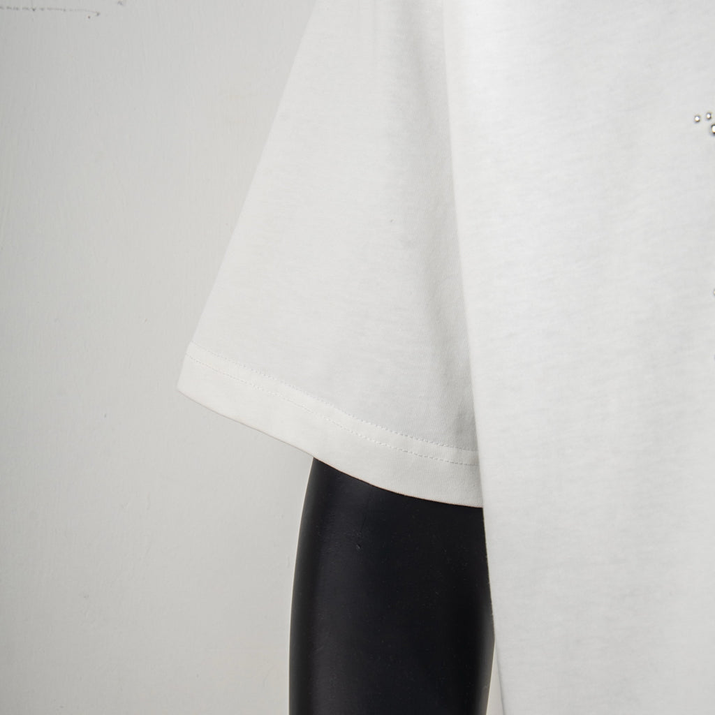 White short-sleeve T-shirt side view showing drape and hem