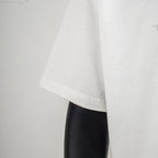 White short-sleeve T-shirt side view showing drape and hem