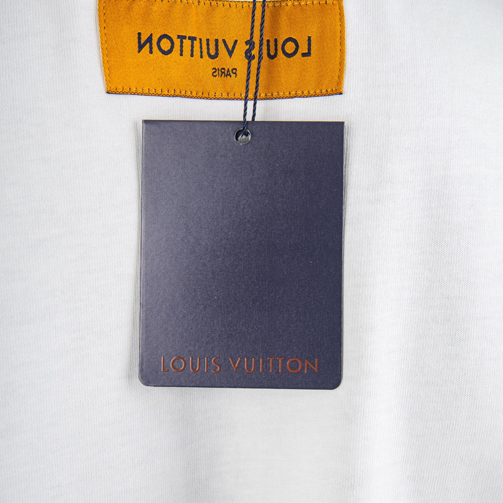 T-shirt neck label and attached tag with Louis Vuitton text