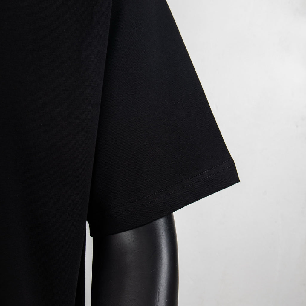 Black T-shirt side view with short sleeve and smooth fabric