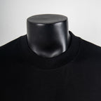 Black crew neck T-shirt neckline close-up