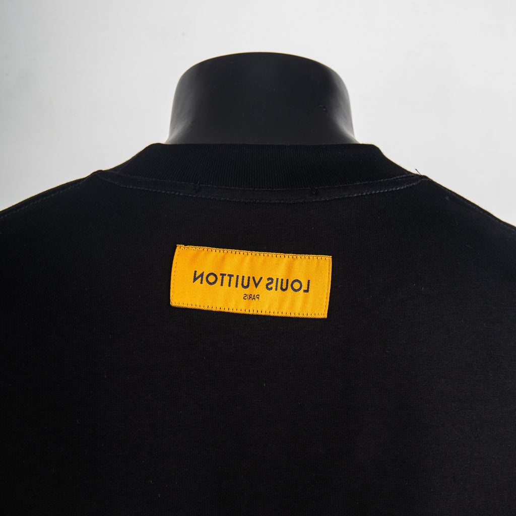 Black T-shirt back with yellow rectangular logo label