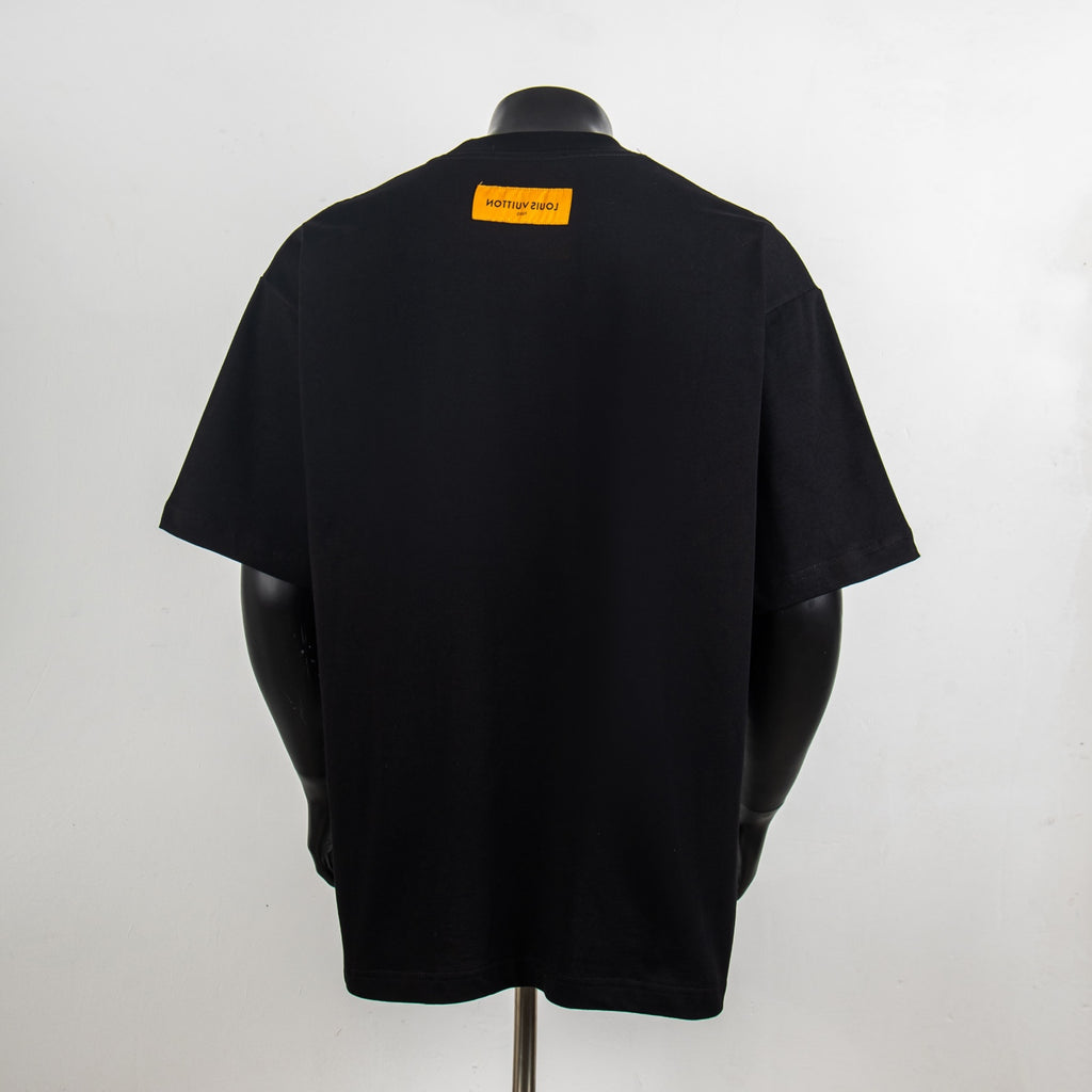 Black short-sleeve T-shirt with yellow back neck label