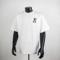 White graphic T-shirt with LV logo chest patch on a crew neck