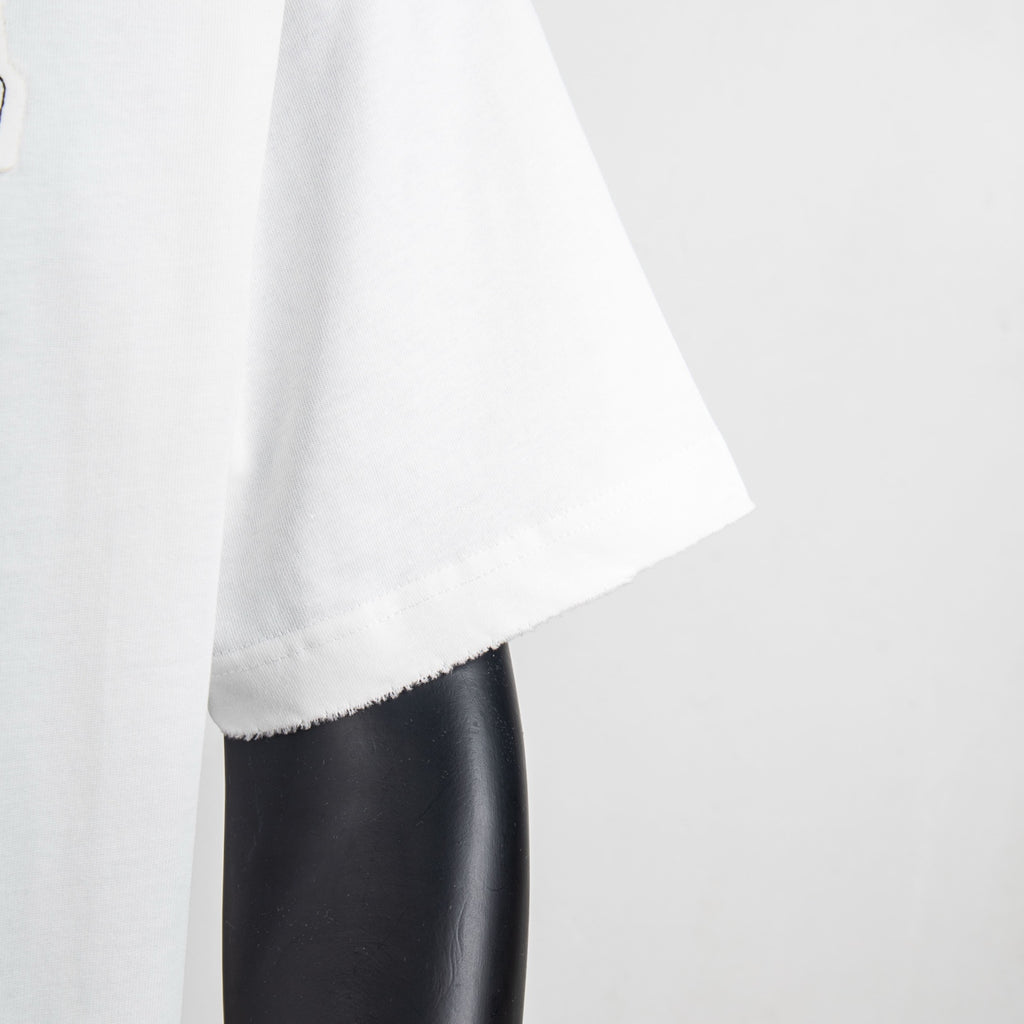 White T-shirt sleeve and side hem with clean curved stitching