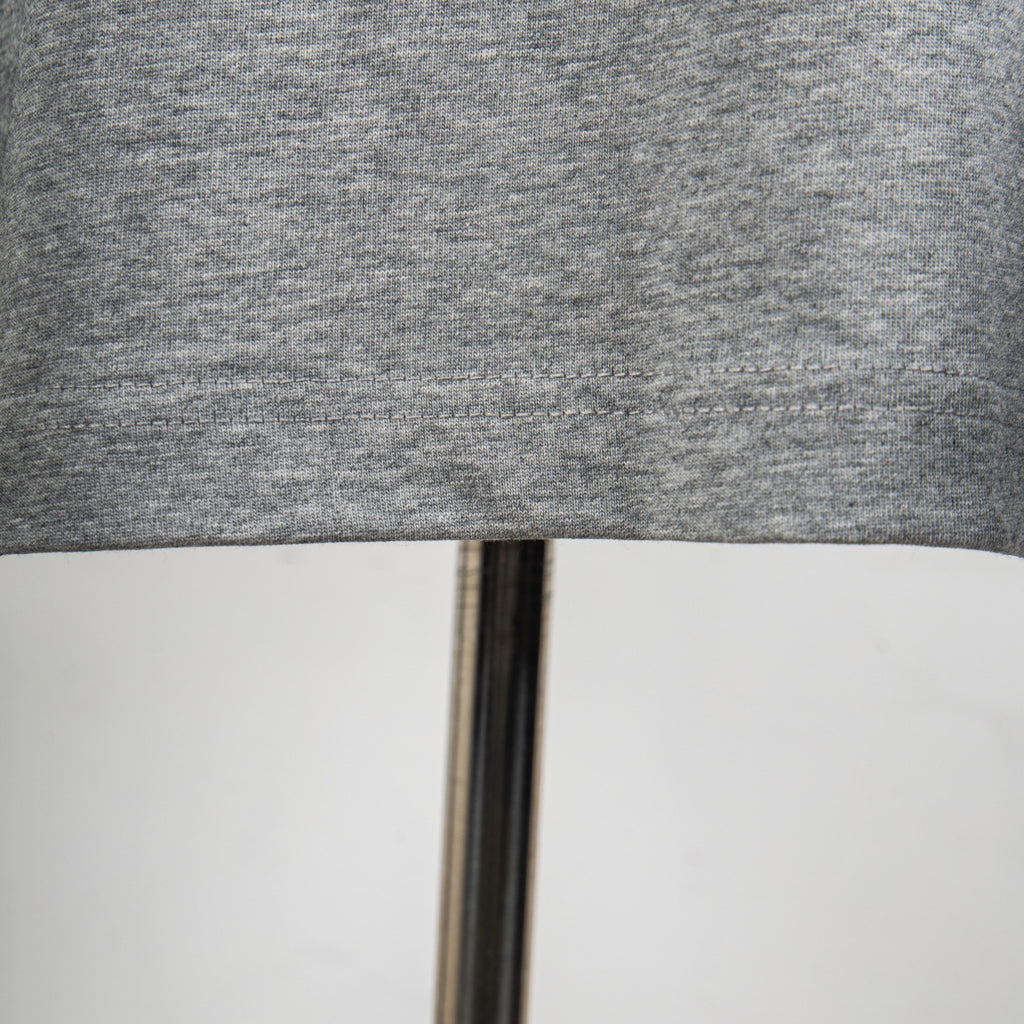 Heather gray T-shirt hem seam detail