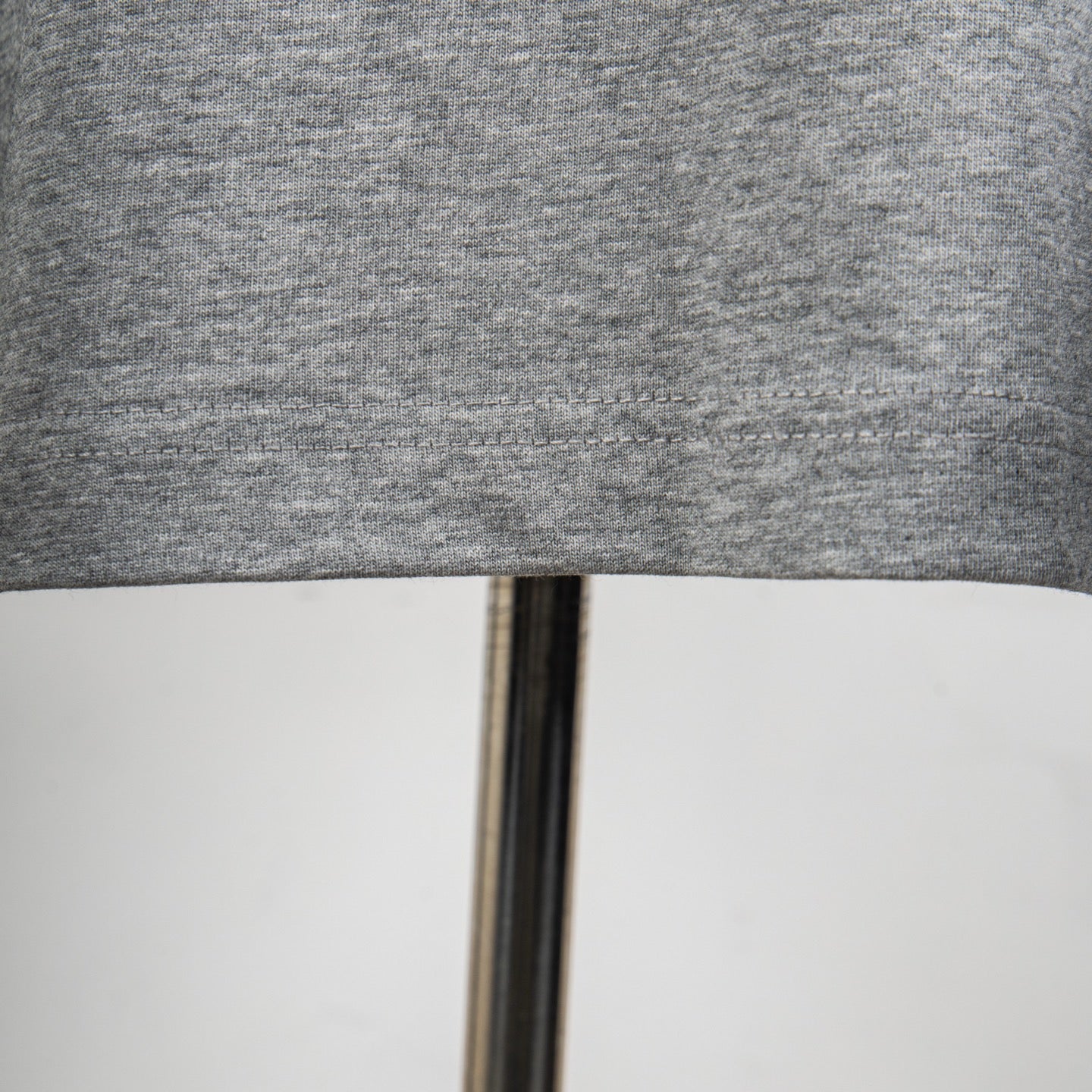 Heather gray T-shirt hem seam detail