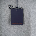 Louis Vuitton T-shirt with navy brand tag attached at chest