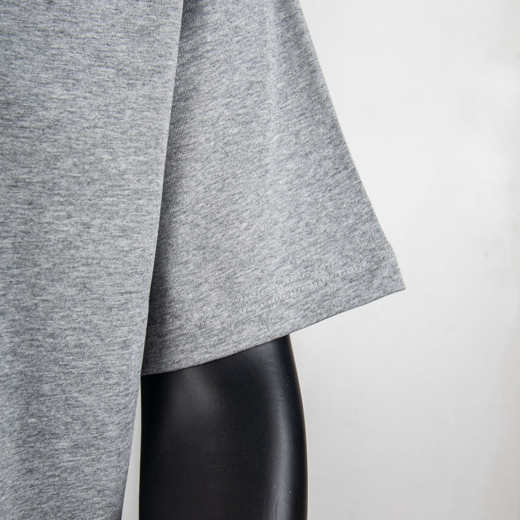 Heather gray T-shirt sleeve hem detail on a mannequin