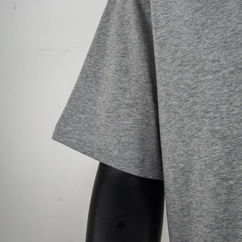 Heather gray T-shirt sleeve and side drape on mannequin