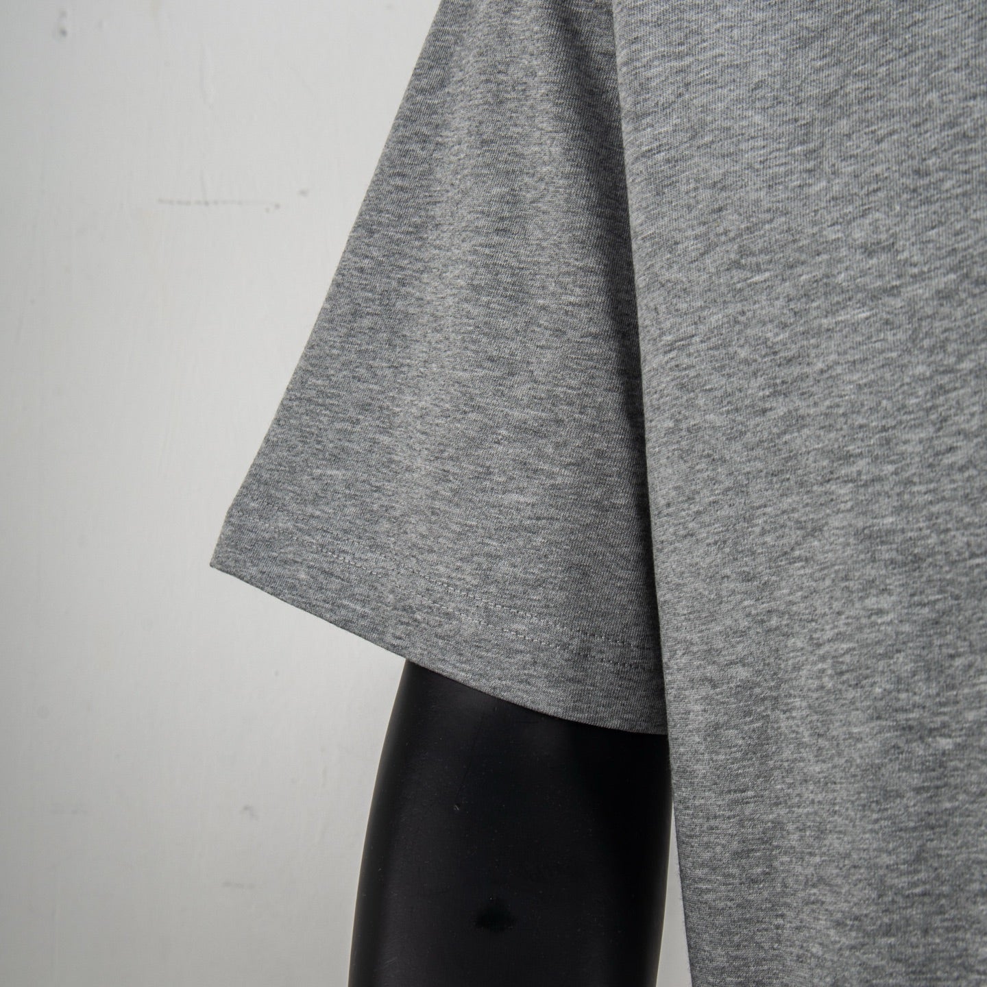 Heather gray T-shirt sleeve and side hem detail