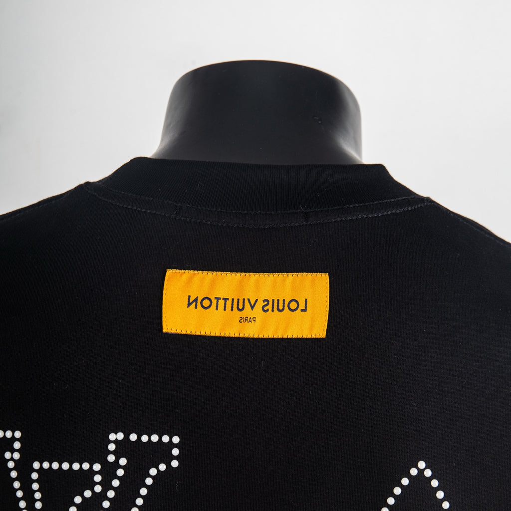 Black T-shirt back collar with yellow brand label