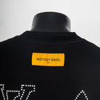 Black T-shirt back collar with yellow brand label