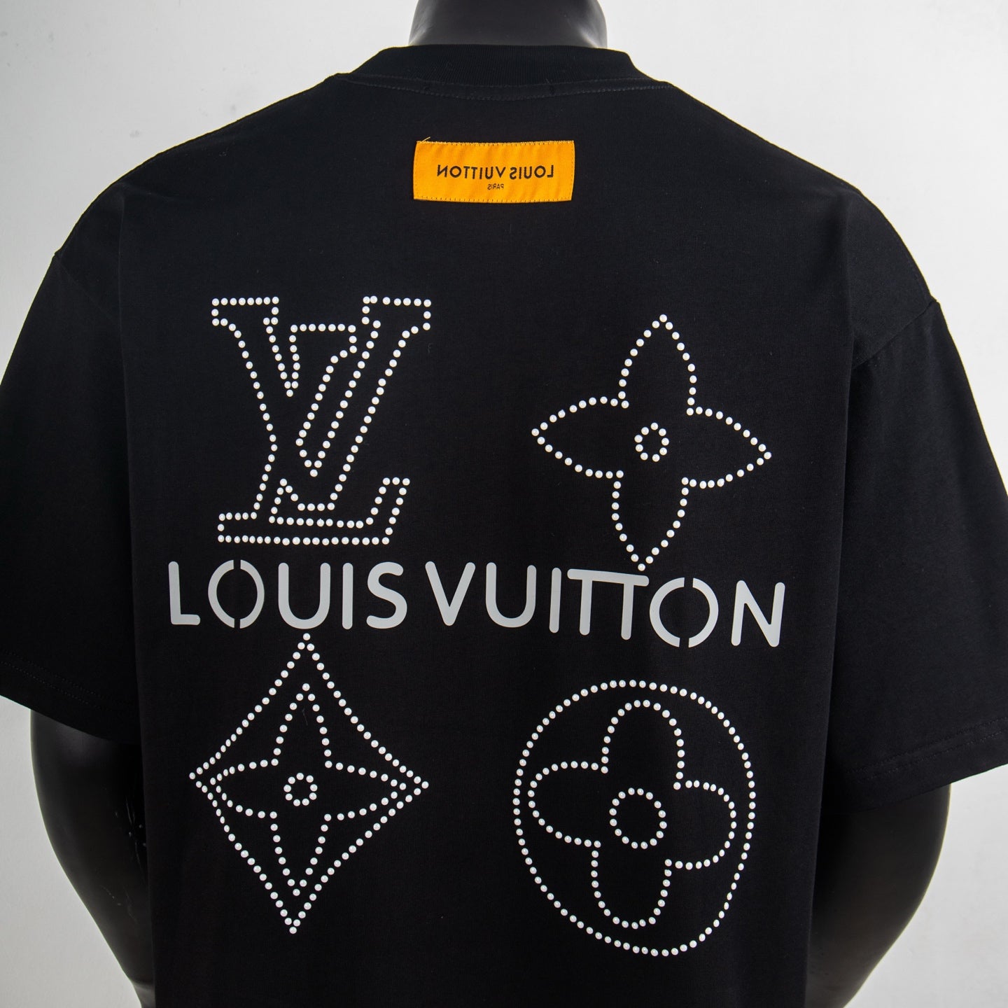 Black T-shirt back with rhinestone Louis Vuitton text and star, clover, diamond motifs