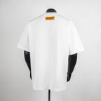 White short-sleeve T-shirt back view with small Louis Vuitton orange neck label