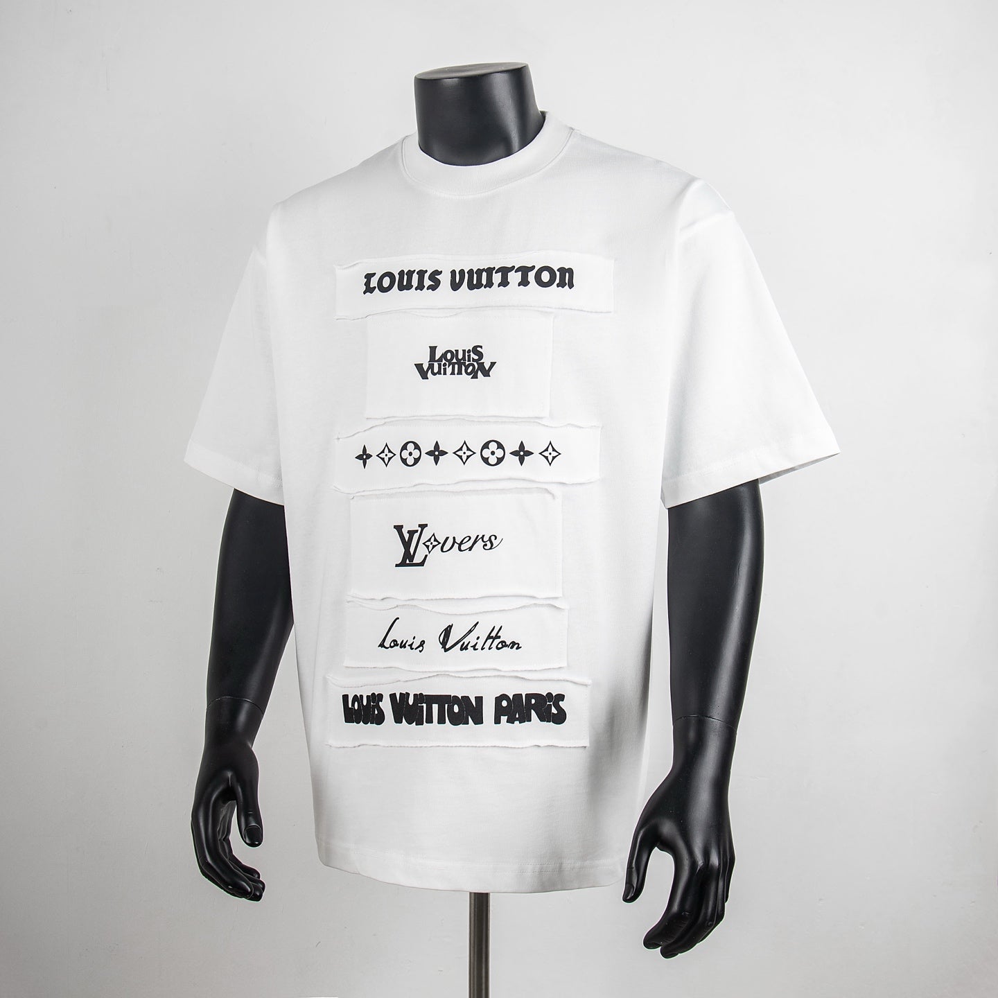 White crew-neck T-shirt with black Louis Vuitton graphic panel prints, short sleeves
