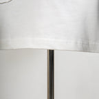 White T-shirt hem stitching detail with side seam