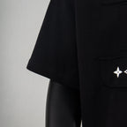 Black T-shirt side view with short sleeve and small logo detail