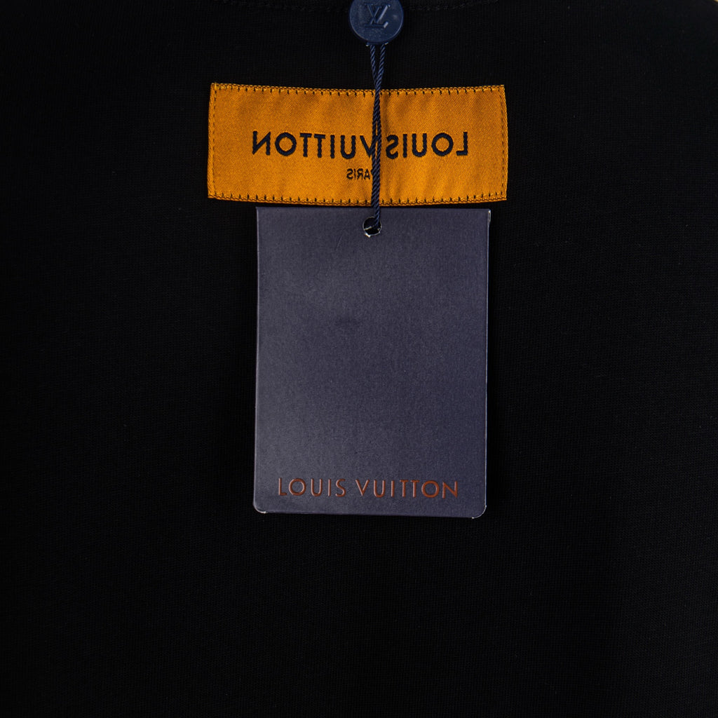 Black T-shirt hang tag with yellow Louis Vuitton label and gray card