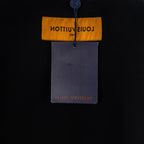 Black T-shirt with orange and gray hanging tag