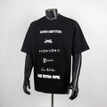 Black graphic T-shirt with Louis Vuitton logo patches on the front