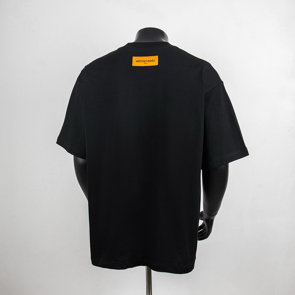 Black graphic T-shirt back view with yellow Louis Vuitton label