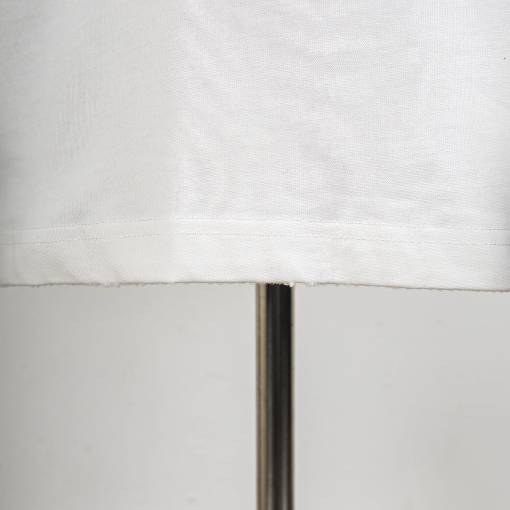 White T-shirt hem with neat stitching detail