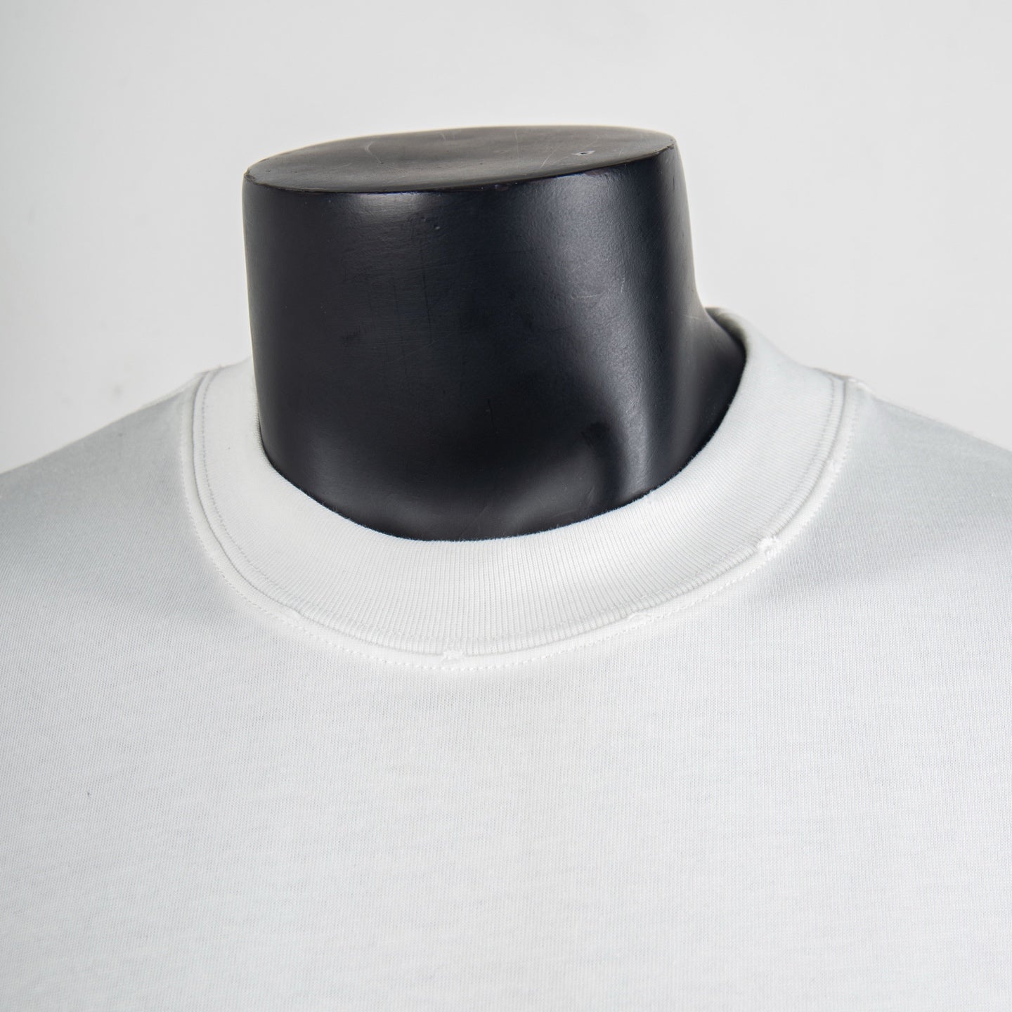 White crewneck T-shirt neckline close-up