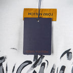 White T-shirt with yellow care label and Louis Vuitton wordmark
