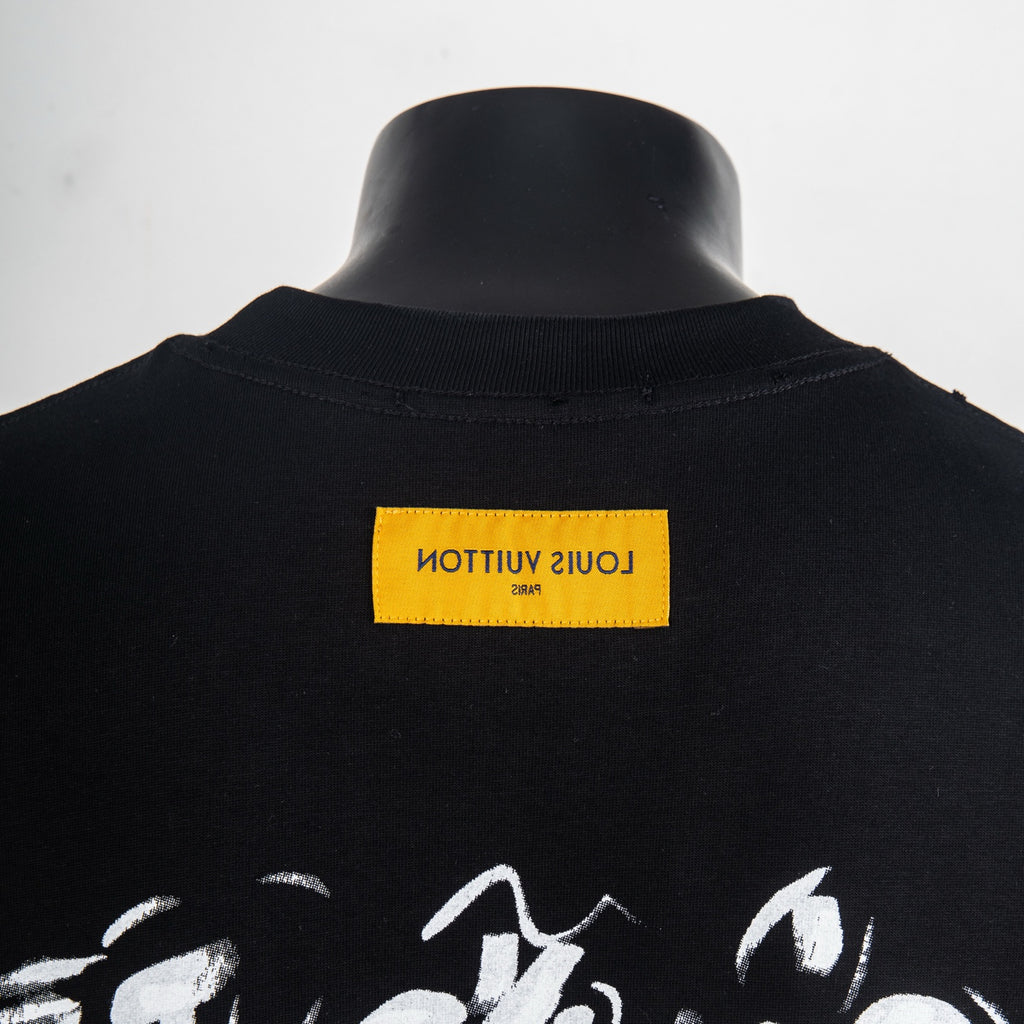 Black T-shirt with yellow neck label and partial white LV graphic