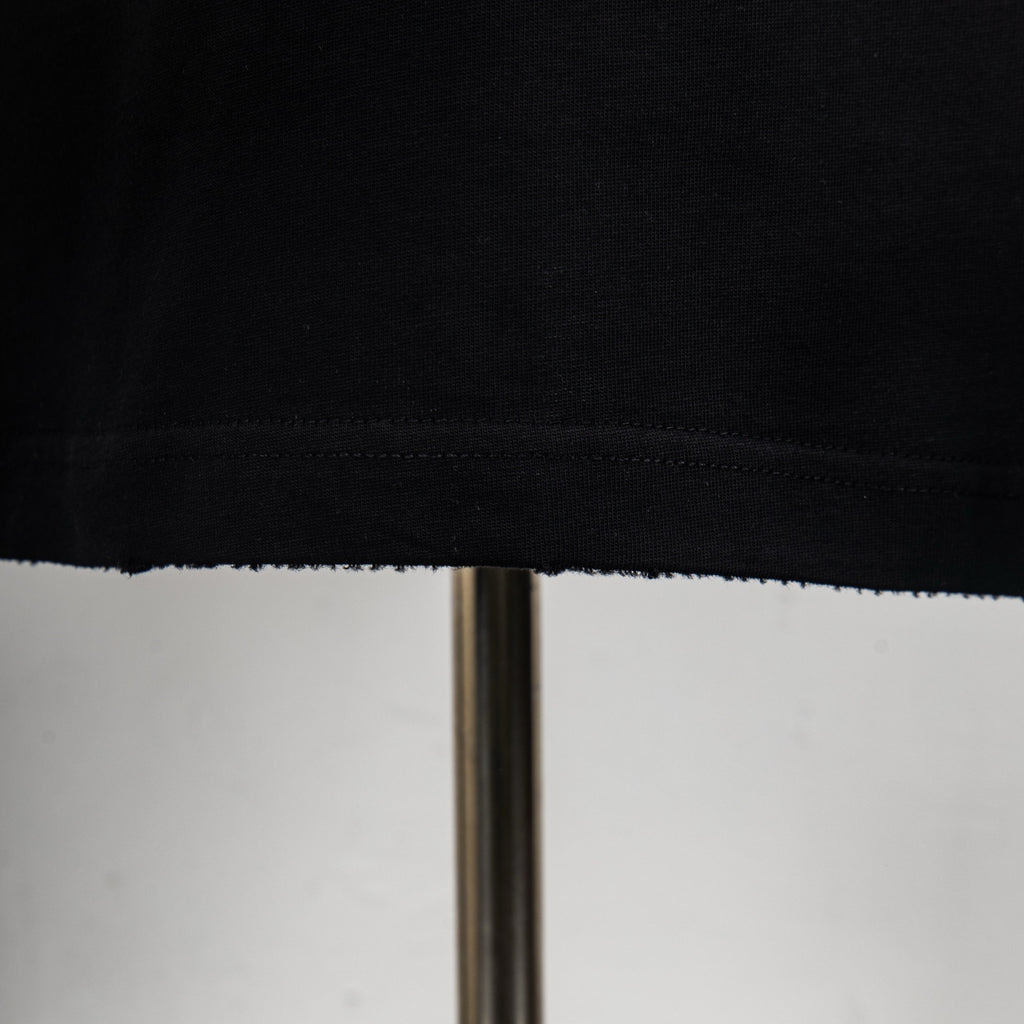 Louis Vuitton T-shirt hem and stitching detail at bottom edge