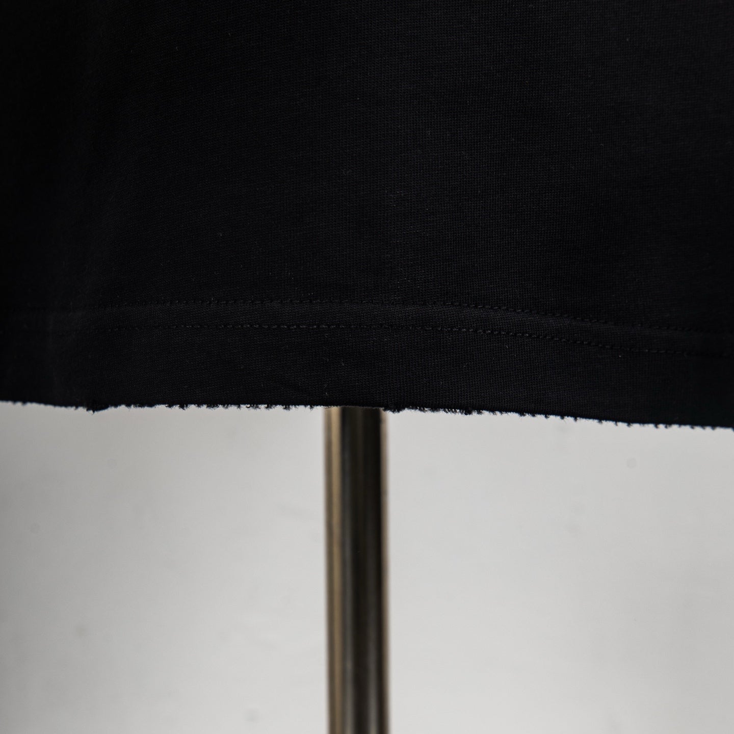 Louis Vuitton T-shirt hem and stitching detail at bottom edge