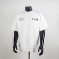 White crewneck T-shirt with 'L.V.M.' logo and small text print at chest