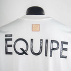White short-sleeve T-shirt with large EQUipe text on back and patch label