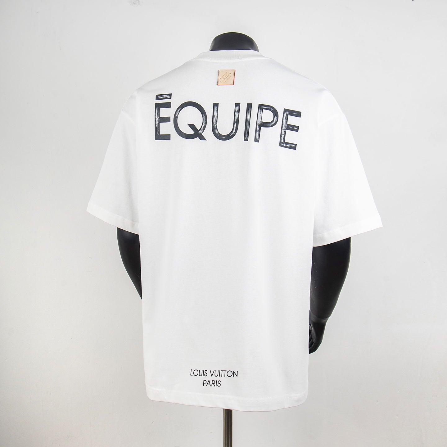 White short-sleeve T-shirt with large EQUipe text on back