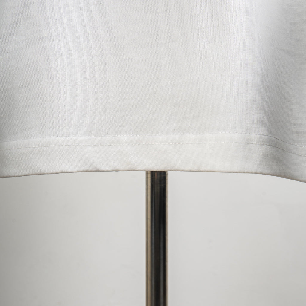 White T-shirt with curved hem seam detail